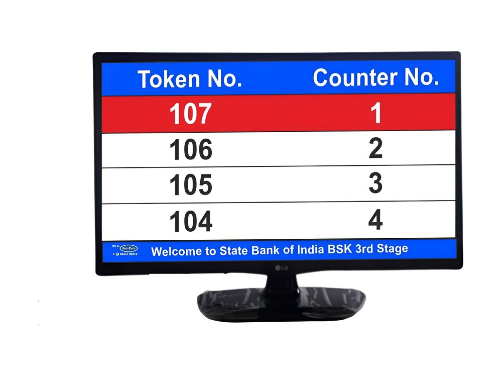 LCD token display in a State Bank of India branch showing four token and counter rows with the branch name along the bottom